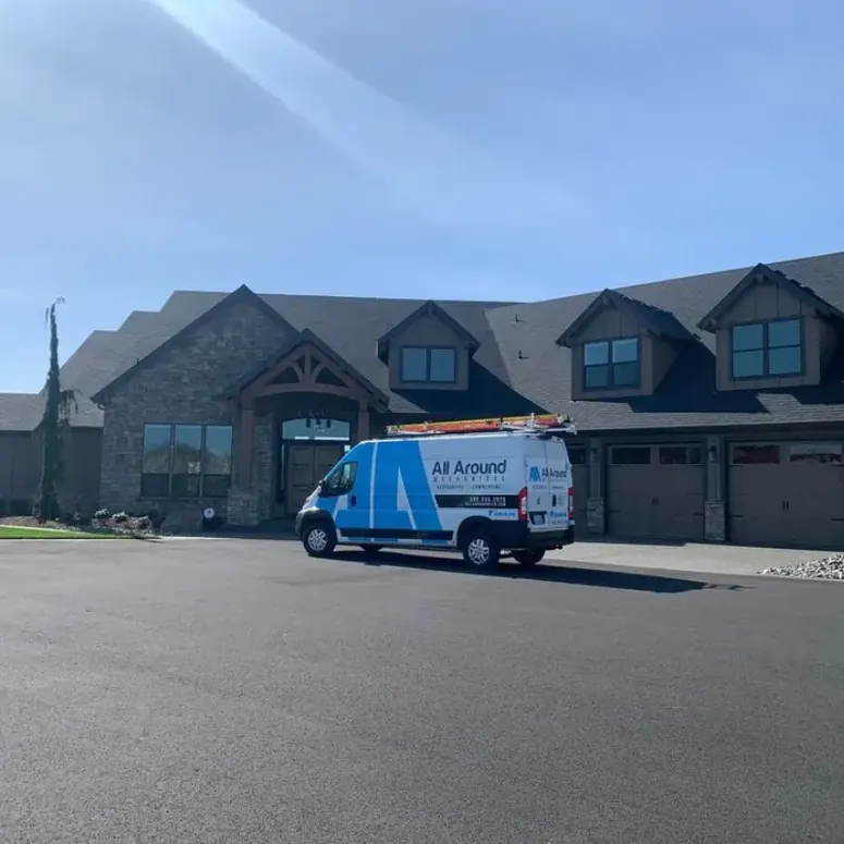 An All Around Mechanical service van parked at a large SW Washington home