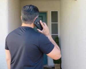 homeowner calling for emergency HVAC service during system breakdown